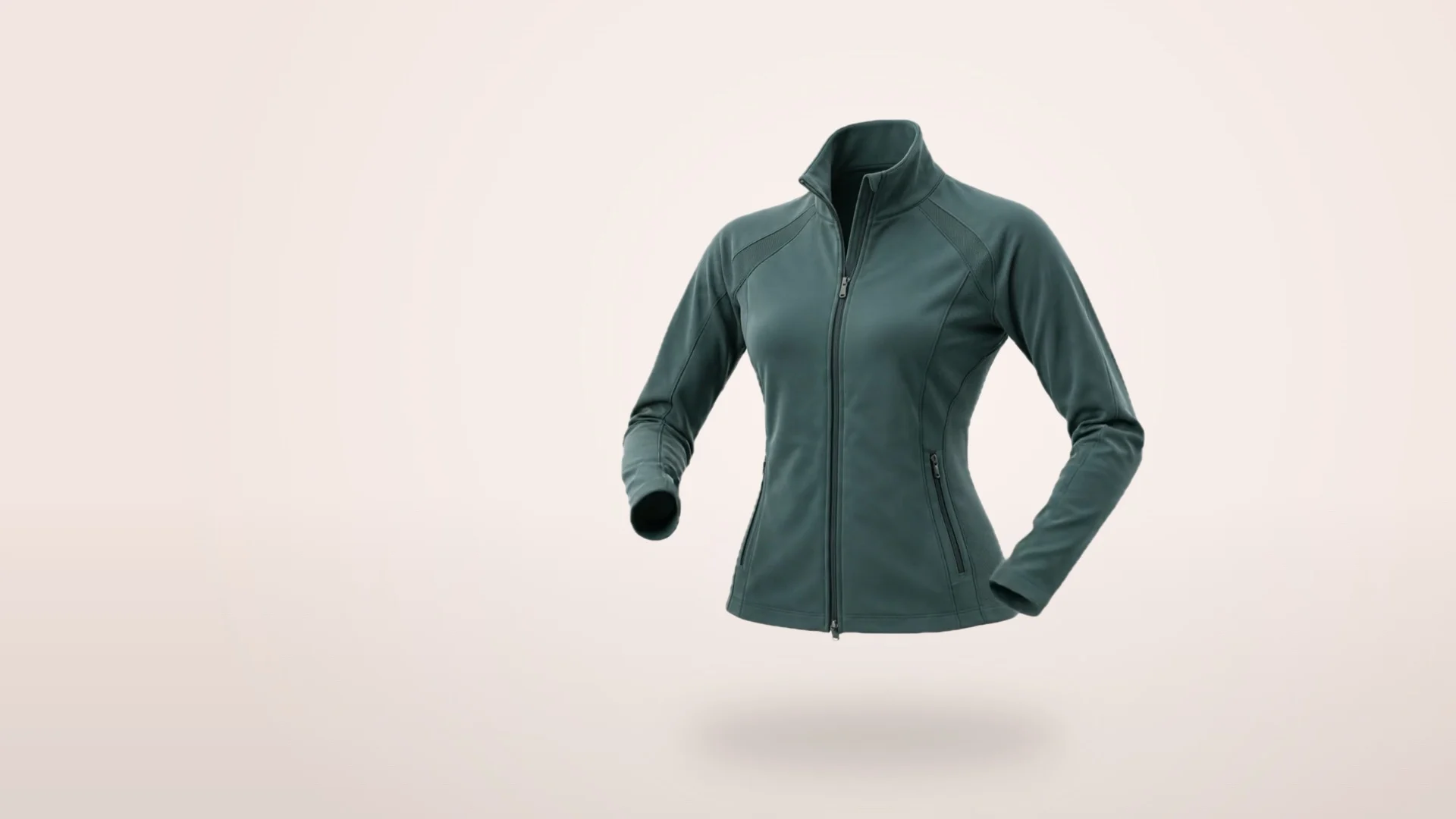A floating green activewear jacket on pale blush