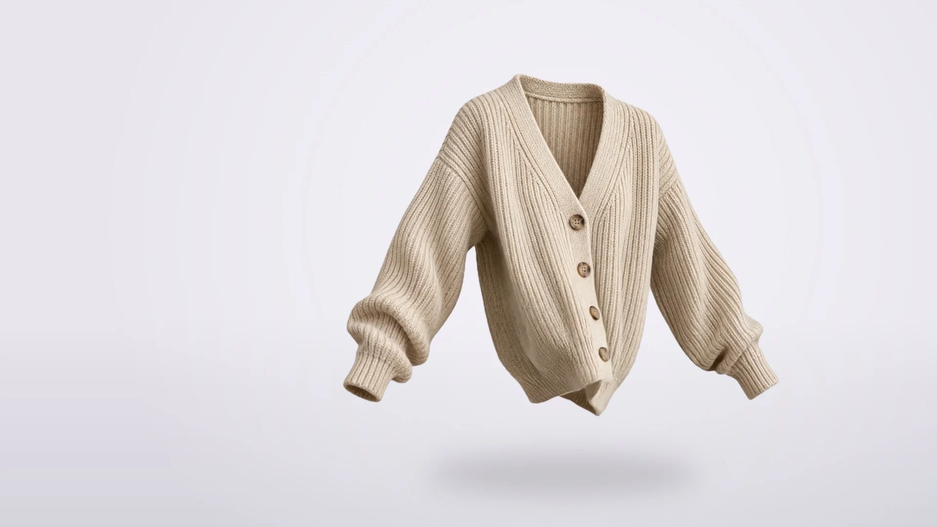 A floating cream ribbed cardigan on pale lilac